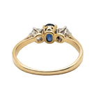 Ogden Of Harrogate Jewellery An 18ct Yellow and White Gold Oval Sapphire and Diamond Three Stone Ring