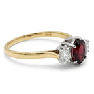 Ogden Of Harrogate Jewellery An 18ct Yellow Gold Ruby and Diamond Three Stone Ring