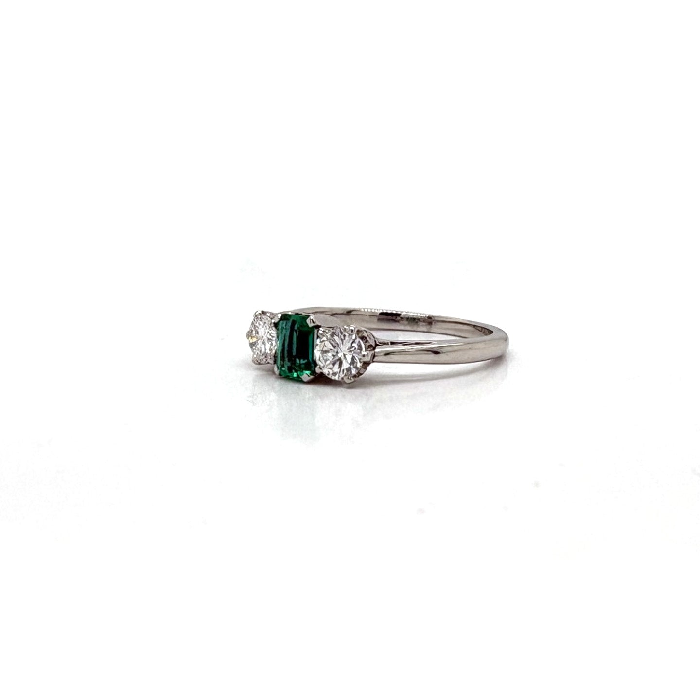 Ogden Of Harrogate Jewellery An Emerald and Diamond Three-stone Ring