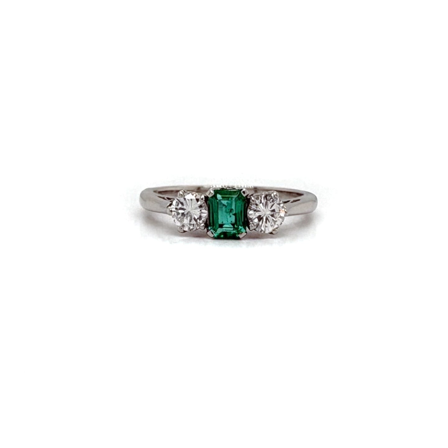 Ogden Of Harrogate Jewellery An Emerald and Diamond Three-stone Ring