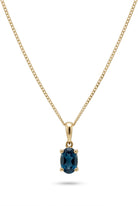 Ogden Of Harrogate Jewellery Oval london Blue Topaz Claw Set Pendant with Chain in 9ct Yellow Gold