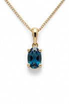 Ogden Of Harrogate Jewellery Oval london Blue Topaz Claw Set Pendant with Chain in 9ct Yellow Gold