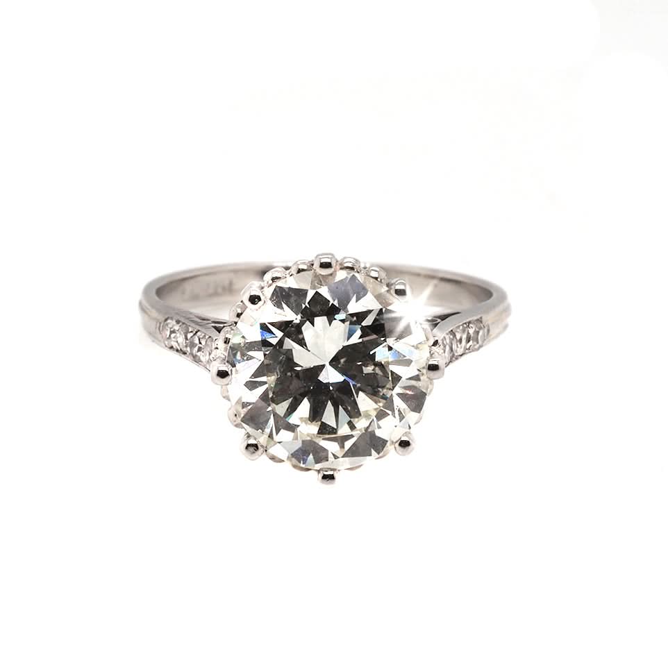 Ogden of Harrogate Jewellery Platinum Diamond Claw Set Solitaire Ring with Diamond Set Shoulders