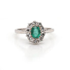 Ogden of Harrogate Jewellery Platinum Emerald and Diamond Surround Cluster Ring, Circa 1930