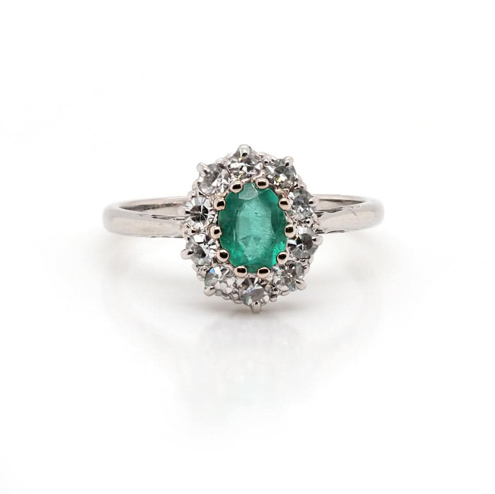 Ogden of Harrogate Jewellery Platinum Emerald and Diamond Surround Cluster Ring, Circa 1930