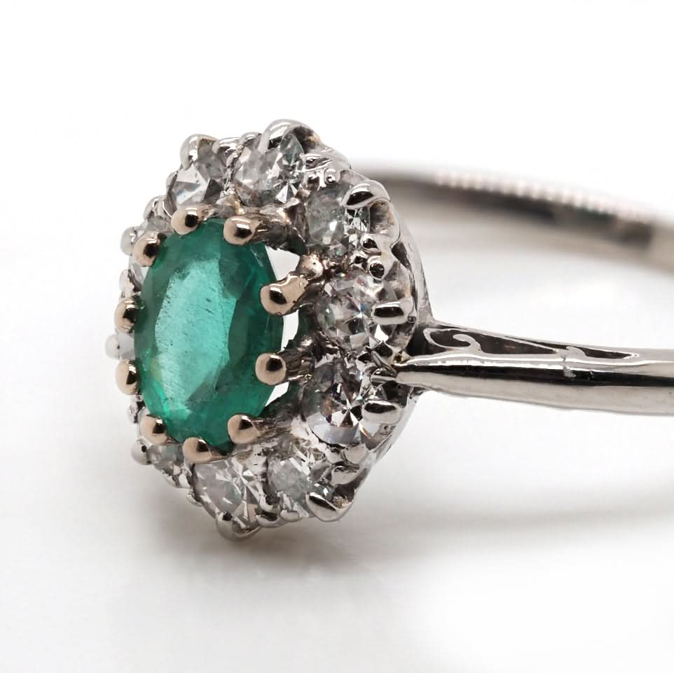Ogden of Harrogate Jewellery Platinum Emerald and Diamond Surround Cluster Ring, Circa 1930