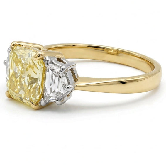 Ogden Of Harrogate Vintage Jewellery A Fancy Yellow Diamond Three Stone Ring in 18ct Yellow and White Gold