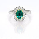 Ogden of Harrogate Jewellery A Platinum, Emerald and Diamond Cluster Ring