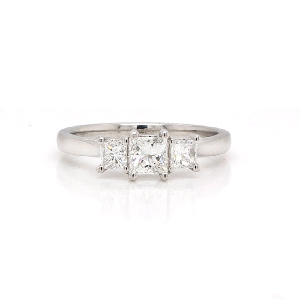 Ogden of Harrogate Jewellery A platinum, princess cut, three stone, diamond ring 0.40cts