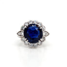 Ogden of Harrogate Jewellery An 18ct Gold Burmese Sapphire and Diamond Cluster Ring