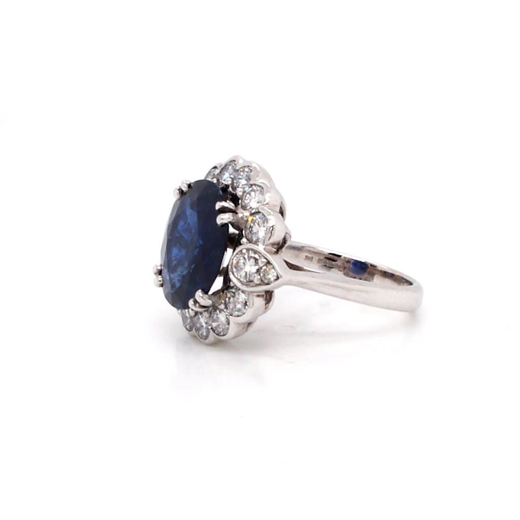 Ogden of Harrogate Jewellery An 18ct Gold Burmese Sapphire and Diamond Cluster Ring