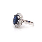 Ogden of Harrogate Jewellery An 18ct Gold Burmese Sapphire and Diamond Cluster Ring