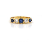 Ogden of Harrogate Jewellery An 18ct Gold, Sapphire and Diamond Five Stone Ring in Carved Setting